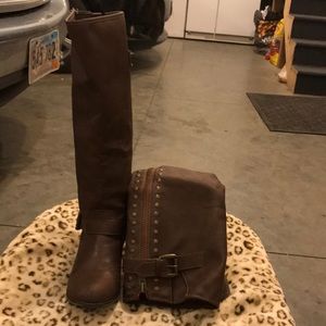 Tall brown boots with red zipper back